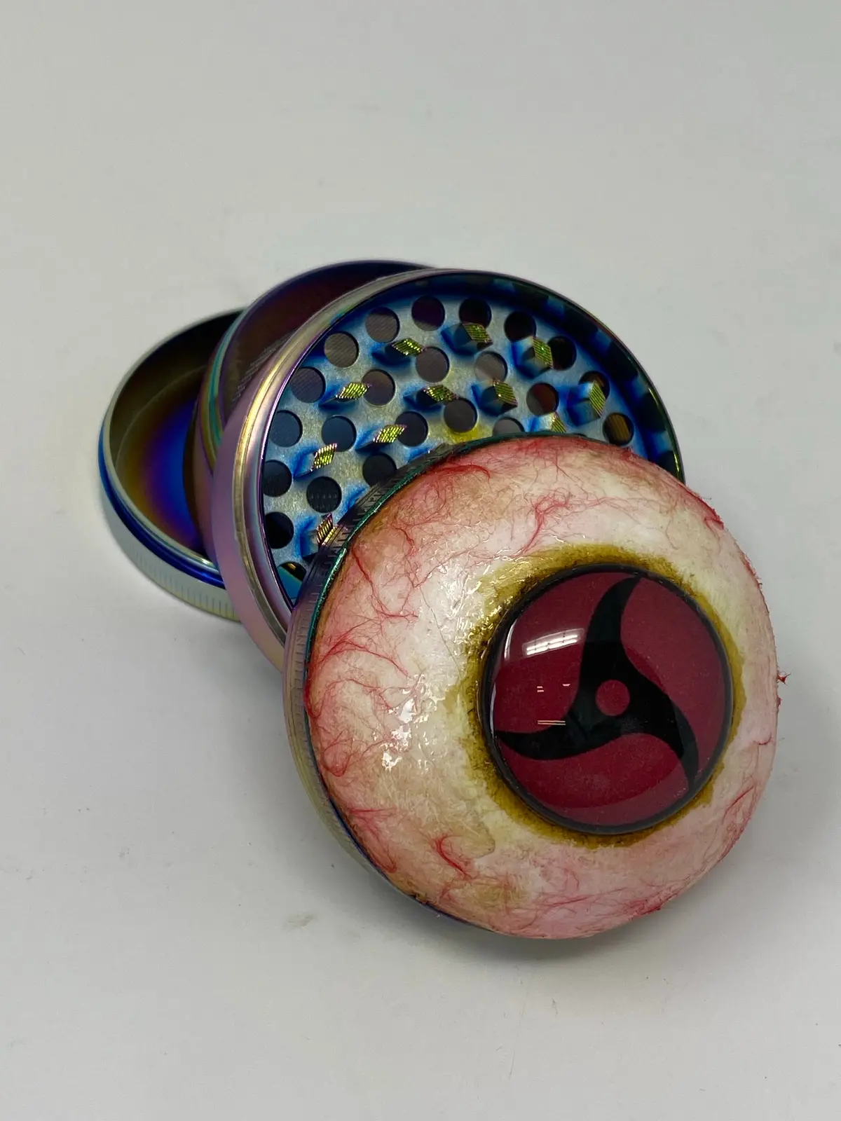 Itachi Sharingan Grinder 1